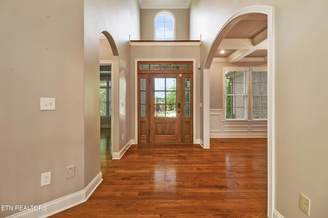 550 Stone Villa Ln, Knoxville, TN 37934 - foyer entrance with crown molding, arched walkways, wood finished floors, beam ceiling, and baseboards