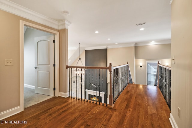 550 Stone Villa Ln, Knoxville, TN 37934 - corridor with ornamental molding, wood finished floors, an upstairs landing, baseboards, and recessed lighting