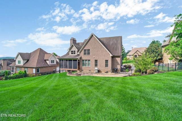 550 Stone Villa Ln, Knoxville, TN 37934 - rear view of house featuring a sunroom, a chimney, and brick siding