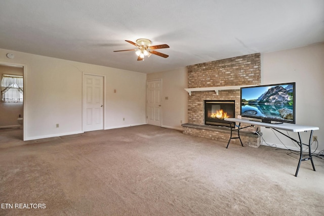 1396 N York Hwy Unit 1396, Jamestown, TN 38556 - unfurnished living room with a ceiling fan, carpet flooring, a brick fireplace, and baseboards