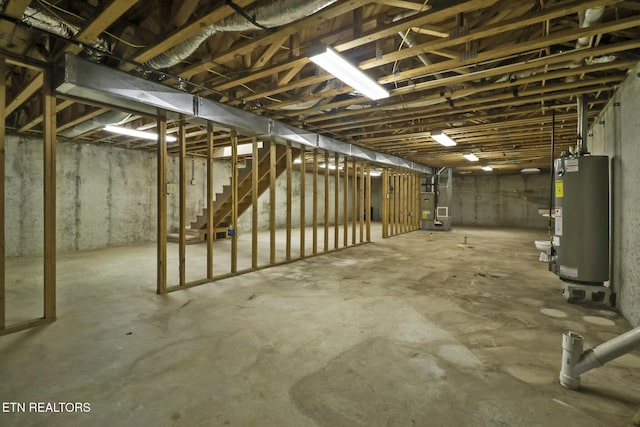1396 N York Hwy Unit 1396, Jamestown, TN 38556 - unfinished below grade area with gas water heater, stairs, and heating unit