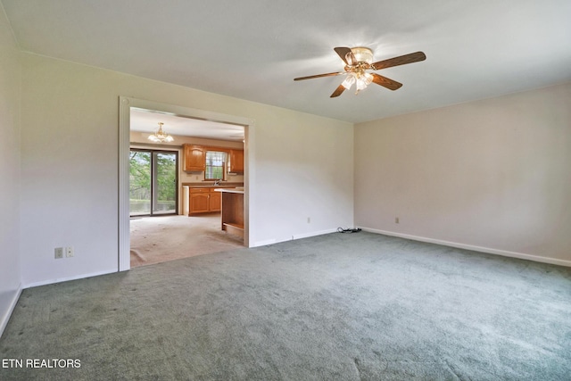 1396 N York Hwy Unit 1396, Jamestown, TN 38556 - unfurnished room with light carpet, ceiling fan, baseboards, and a chandelier