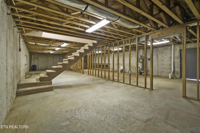 1396 N York Hwy Unit 1396, Jamestown, TN 38556 - unfinished below grade area featuring stairs and water heater