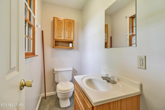 1396 N York Hwy Unit 1396, Jamestown, TN 38556 - half bathroom featuring toilet, vanity, and baseboards
