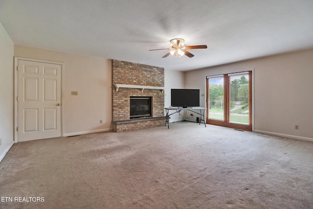 1396 N York Hwy Unit 1396, Jamestown, TN 38556 - unfurnished living room featuring a ceiling fan, carpet, baseboards, and a brick fireplace