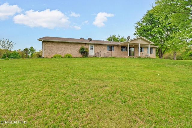 1396 N York Hwy Unit 1396, Jamestown, TN 38556 - ranch-style home featuring a front lawn and brick siding