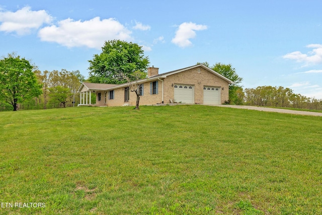 1396 N York Hwy Unit 1396, Jamestown, TN 38556 - ranch-style home featuring driveway, a chimney, an attached garage, a front yard, and brick siding