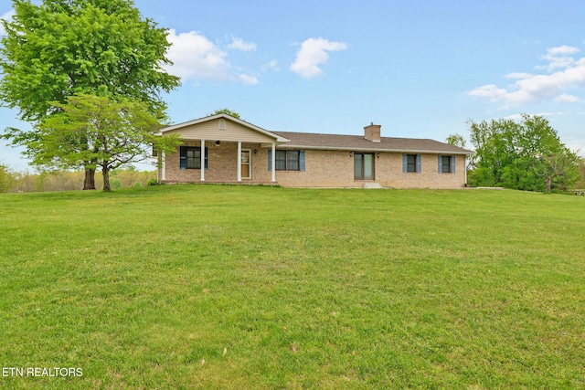 1396 N York Hwy Unit 1396, Jamestown, TN 38556 - ranch-style house with a front lawn, a chimney, brick siding, and a porch