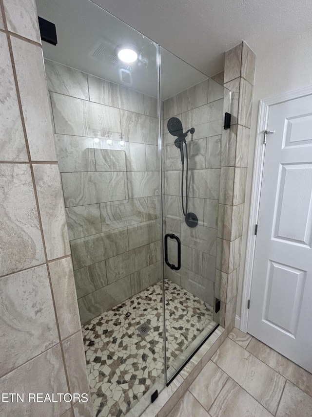 342 N Norris St, Jamestown, TN 38556 - bathroom featuring a stall shower and marble finish flooring