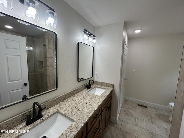 342 N Norris St, Jamestown, TN 38556 - full bath featuring double vanity, toilet, marble look tiles, baseboards, and a tile shower