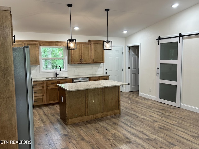 342 N Norris St, Jamestown, TN 38556 - kitchen featuring a sink, stainless steel appliances, decorative backsplash, a kitchen island, and dark wood-type flooring