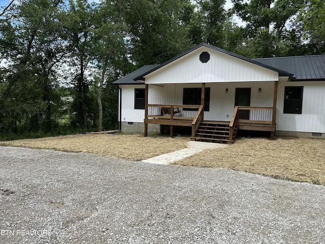 342 N Norris St, Jamestown, TN 38556 - view of front of house featuring crawl space, covered porch, metal roof, and view of scattered trees