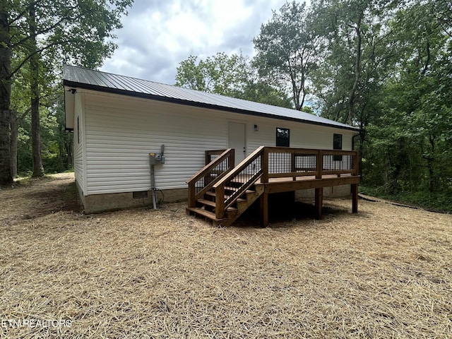 342 N Norris St, Jamestown, TN 38556 - back of property featuring crawl space, a wooden deck, and metal roof