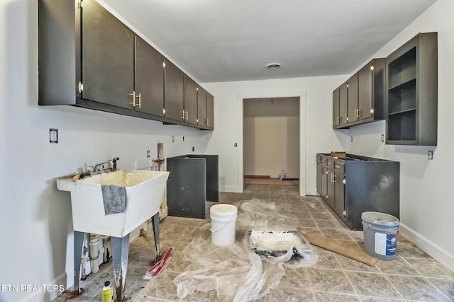 1128 Allardt Hwy, Jamestown, TN 38556 - laundry area featuring baseboards, washer hookup, and light stone finish flooring