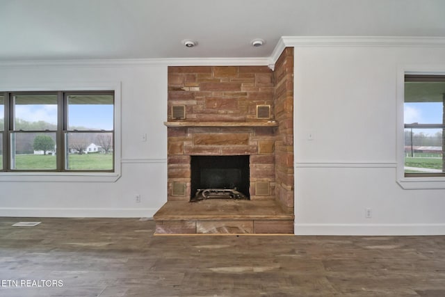 1128 Allardt Hwy, Jamestown, TN 38556 - unfurnished living room with crown molding, a fireplace, baseboards, and wood finished floors