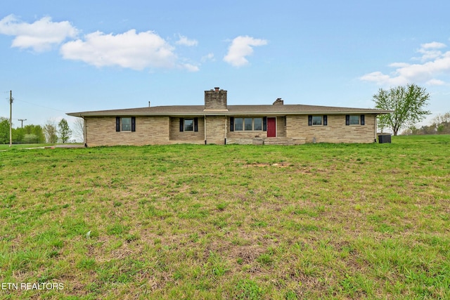 1128 Allardt Hwy, Jamestown, TN 38556 - rear view of property with a yard, a chimney, and central AC unit