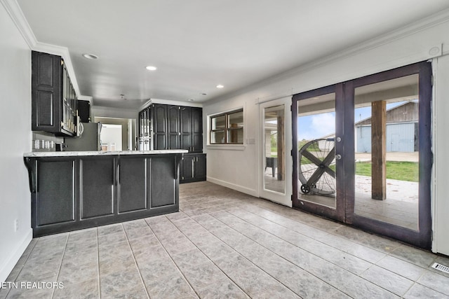 1128 Allardt Hwy, Jamestown, TN 38556 - kitchen featuring crown molding, dark cabinets, baseboards, recessed lighting, and a peninsula
