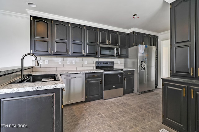 1128 Allardt Hwy, Jamestown, TN 38556 - kitchen with stainless steel appliances, ornamental molding, a sink, tile patterned floors, and light stone countertops