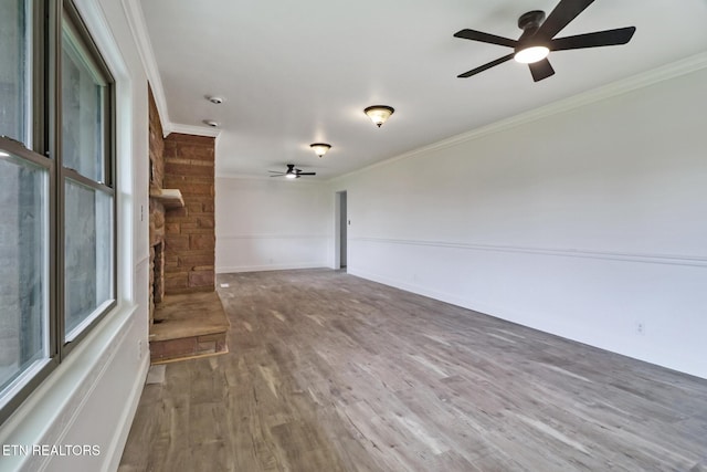 1128 Allardt Hwy, Jamestown, TN 38556 - unfurnished living room featuring a ceiling fan, ornamental molding, wood finished floors, and baseboards