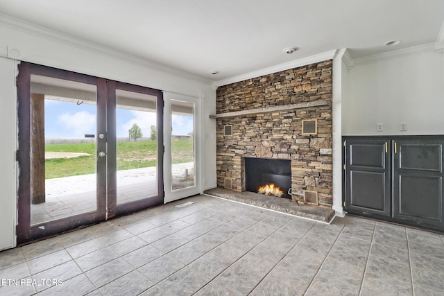 1128 Allardt Hwy, Jamestown, TN 38556 - unfurnished living room featuring french doors, crown molding, light tile patterned floors, and a stone fireplace