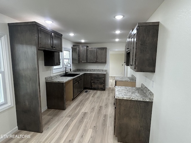1462 Pennsylvania Ave, Jamestown, TN 38556 - kitchen featuring a sink, light wood finished floors, baseboards, recessed lighting, and dark brown cabinetry