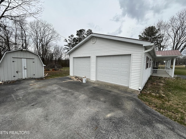 1462 Pennsylvania Ave, Jamestown, TN 38556 - garage featuring a storage shed and covered porch