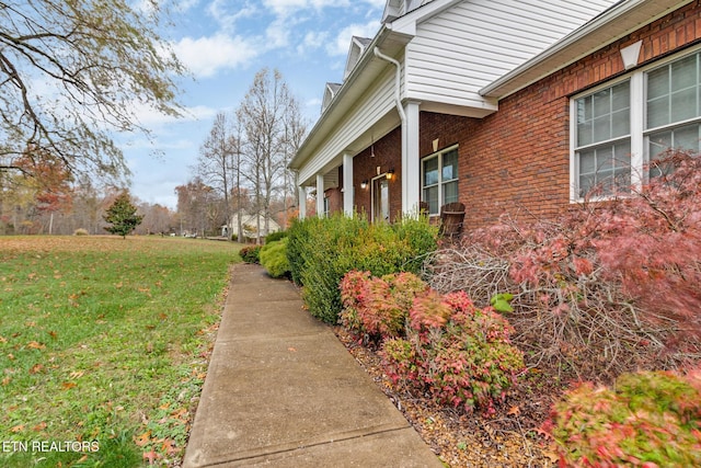 5424 Wilder Rd, Grimsley, TN 38565 - view of home's exterior with a yard and brick siding