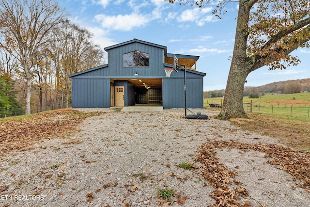 8225 Red Hill Rd, Pall Mall, TN 38577 - view of front of home with an outbuilding and board and batten siding