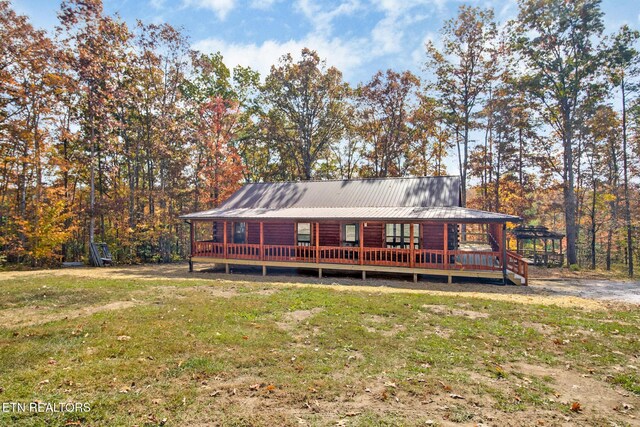 1292 Terry Ln, Jamestown, TN 38556 - rear view of property with a yard, a deck, and metal roof