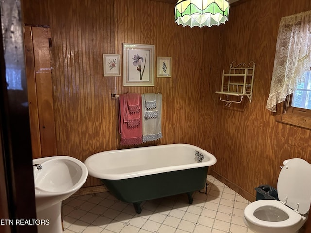 301 Joe Barnett Rd, Jamestown, TN 38556 - bathroom with a freestanding tub, wood walls, and toilet