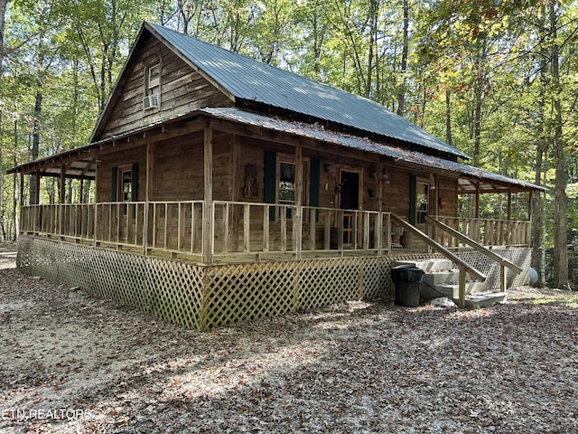 301 Joe Barnett Rd, Jamestown, TN 38556 - view of side of home featuring a porch and metal roof