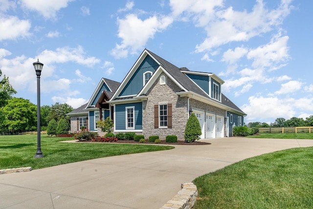 3013 Berry Patch Trl, Rockvale, TN 37153 - view of front of house with concrete driveway, stone siding, a garage, board and batten siding, and a shingled roof