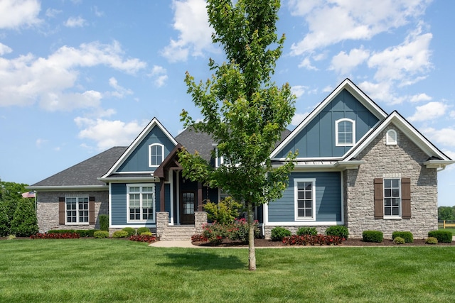 3013 Berry Patch Trl, Rockvale, TN 37153 - craftsman-style house with stone siding, a front yard, and board and batten siding