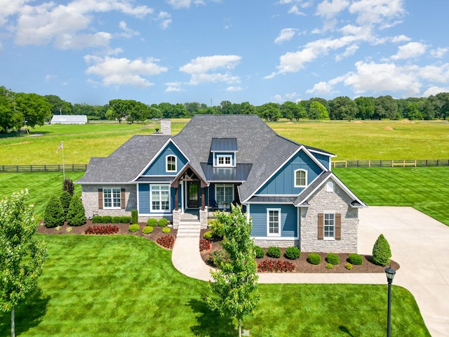 3013 Berry Patch Trl, Rockvale, TN 37153 - craftsman-style home with stone siding, board and batten siding, a porch, and a chimney