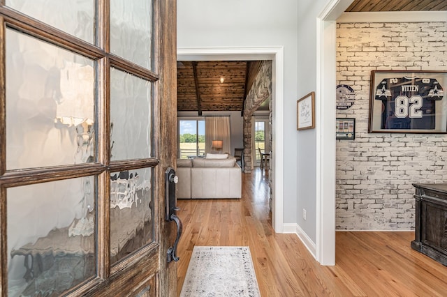 3013 Berry Patch Trl, Rockvale, TN 37153 - hallway featuring light wood finished floors, baseboards, brick wall, and wood ceiling