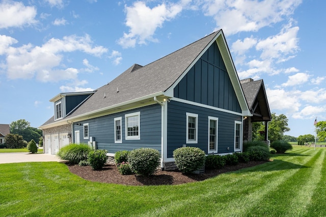 3013 Berry Patch Trl, Rockvale, TN 37153 - view of side of home featuring board and batten siding, a yard, driveway, roof with shingles, and an attached garage