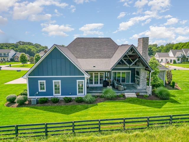 3013 Berry Patch Trl, Rockvale, TN 37153 - rear view of property featuring board and batten siding, a chimney, a shingled roof, and central AC