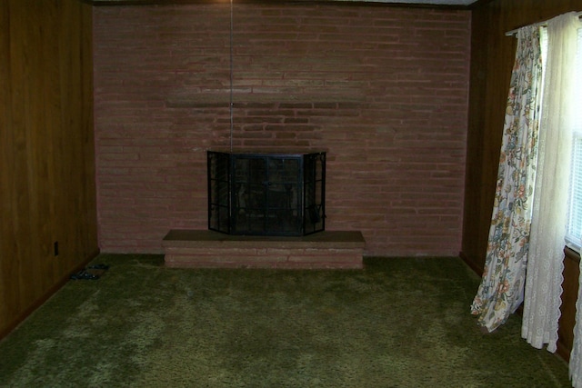 7985 Francis Ferry Rd, Rock Island, TN 38581 - unfurnished living room featuring carpet, a fireplace, and wood walls