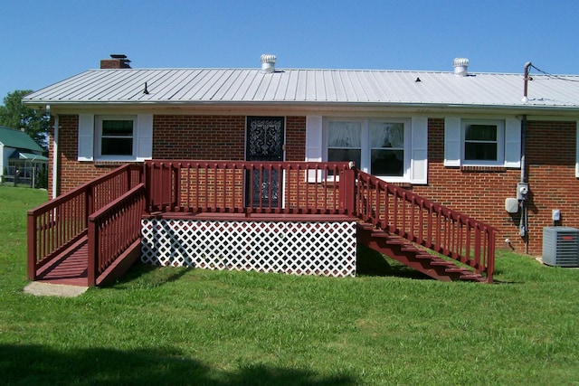 7985 Francis Ferry Rd, Rock Island, TN 38581 - back of property with brick siding, a lawn, central air condition unit, and a chimney