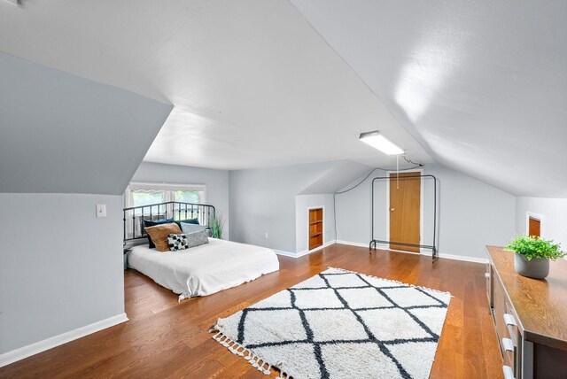6085 Blue Springs Rd, Cadiz, KY 42211 - bedroom featuring vaulted ceiling, wood finished floors, and baseboards