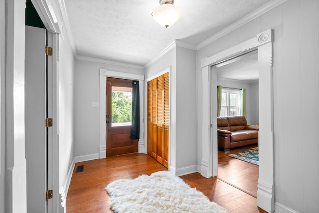 6085 Blue Springs Rd, Cadiz, KY 42211 - entryway with wood-type flooring, a textured ceiling, ornamental molding, and baseboards