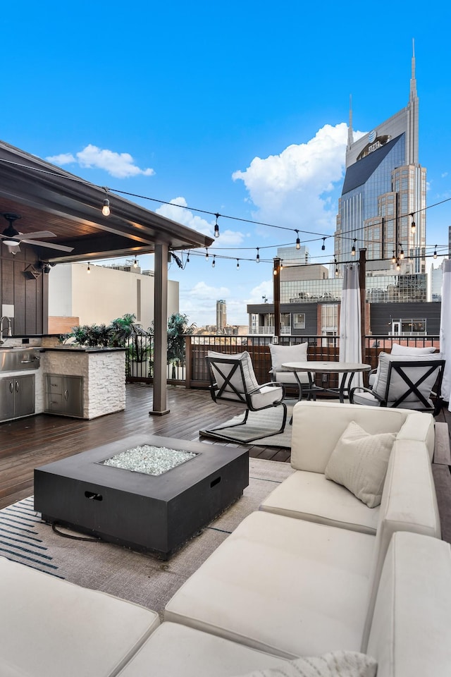 207 3rd Ave N Unit 602, Nashville, TN 37201 - view of patio / terrace with an outdoor living space with a fire pit, a deck, area for grilling, and a sink