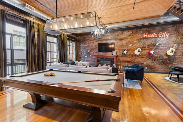 207 3rd Ave N Unit 602, Nashville, TN 37201 - rec room featuring wood ceiling, billiards, a glass covered fireplace, and wood finished floors