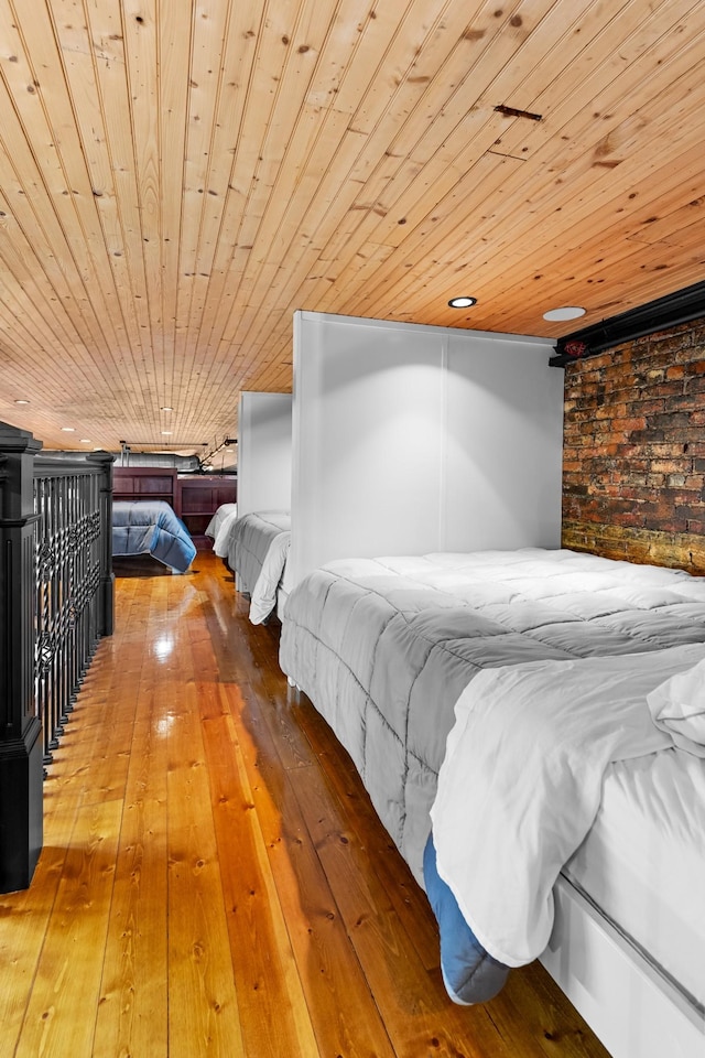 207 3rd Ave N Unit 602, Nashville, TN 37201 - bedroom with wooden ceiling, hardwood / wood-style flooring, and brick wall