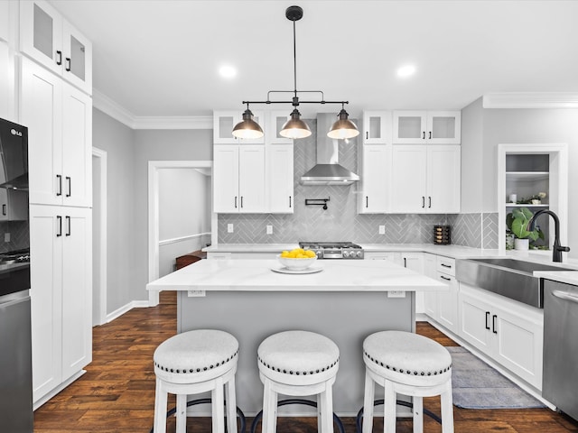 2207 Oakwood Ct, Franklin, TN 37064 - kitchen with wall chimney exhaust hood, a sink, dishwasher, stove, and a breakfast bar area