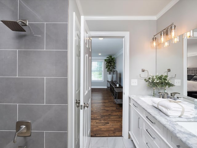2207 Oakwood Ct, Franklin, TN 37064 - bathroom with ensuite bath, crown molding, tiled shower, double vanity, and wood finished floors