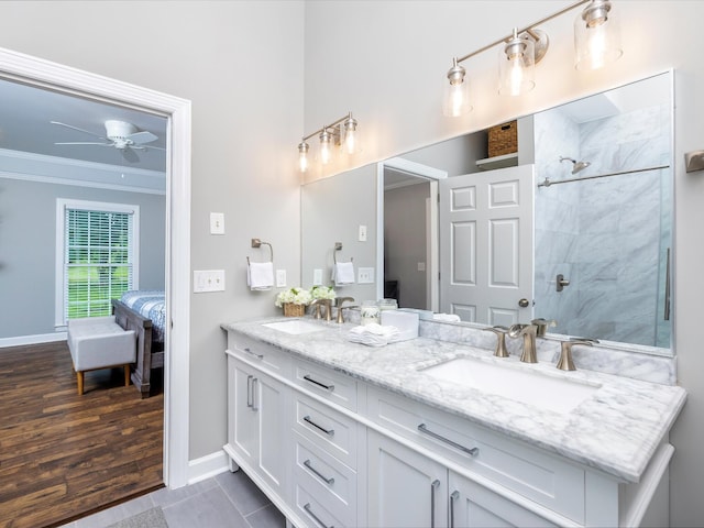 2207 Oakwood Ct, Franklin, TN 37064 - full bath with connected bathroom, double vanity, ornamental molding, a tile shower, and ceiling fan