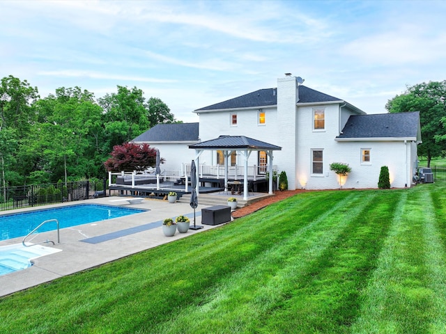 2207 Oakwood Ct, Franklin, TN 37064 - rear view of house featuring a gazebo, a patio, a chimney, roof with shingles, and central AC