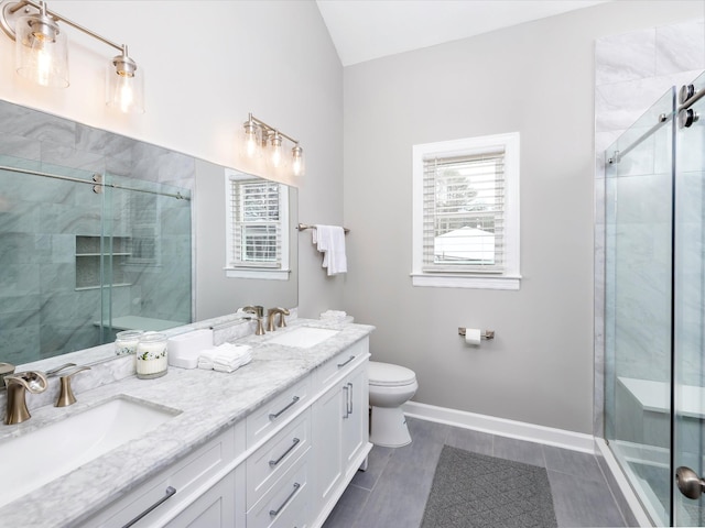 2207 Oakwood Ct, Franklin, TN 37064 - bathroom featuring a shower stall, toilet, double vanity, vaulted ceiling, and baseboards