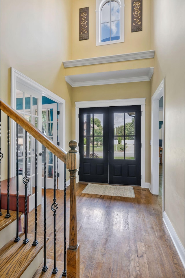 2122 Slater Dr, Murfreesboro, TN 37128 - foyer with a high ceiling, ornamental molding, wood finished floors, french doors, and baseboards